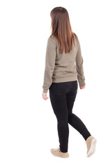 side view of walking  woman in jeans. beautiful girl in motion.