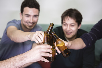 friends with pizza and bottles of drinks at apartment student. D