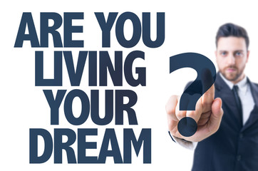 Business man pointing the text: Are You Living Your Dream?