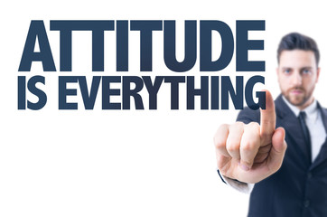 Business man pointing the text: Attitude is Everything