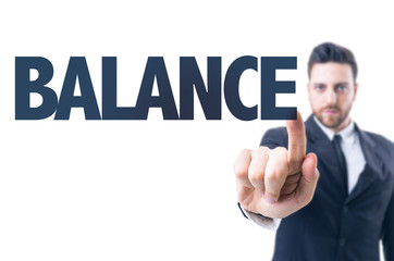 Business man pointing the text: Balance