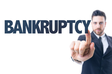 Business man pointing the text: Bankruptcy