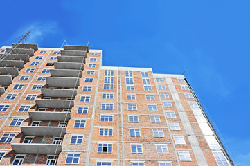 Fototapeta premium Building construction site work against blue sky