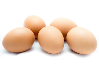 Five eggs on white background