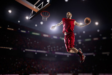 Fototapeta na wymiar red Basketball player in action