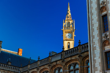 Clock tower at Quay Graslei in Ghent town, Belgium