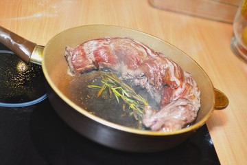 Grilled beef steak with rosemary on frying pan