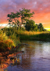 Fototapeta na wymiar River at sunset