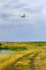 Fototapeta na wymiar Plane over the river