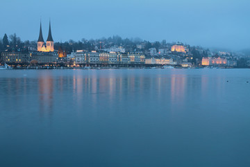 Fototapeta na wymiar Embankment and Saint Leodegar church. Lucerne, Switzerland
