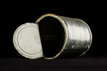 Open tin can isolated on the black background