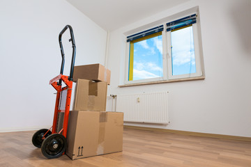 cardboard boxes in an empty apartment. moving to a new apartment