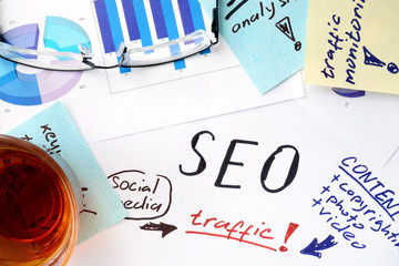 Papers with text, graphs and seo (search engine optimization).