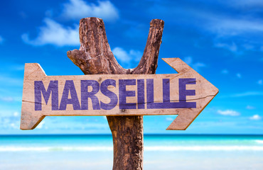 Marseille wooden sign with beach background