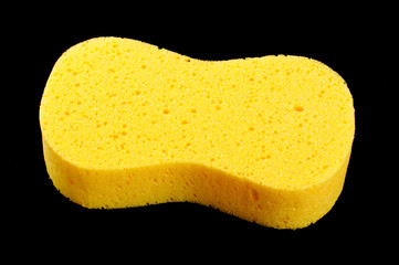 Yellow car wash sponge isolated on the black background