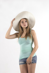 pretty woman in hat over white background