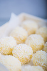 Homemade Coconut Pralines in a wooden box.