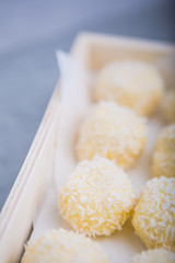 Homemade Coconut Pralines in a wooden box.