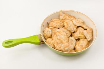 meat in a frying pan