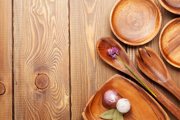 Fototapeta na wymiar Wood kitchen utensils over wooden table