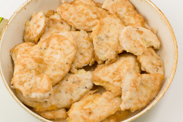 meat in a frying pan