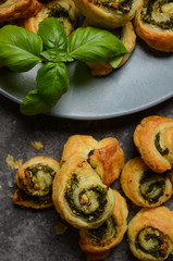 Fototapeta na wymiar Puff pastry rolls with spinach and greek cheese filling