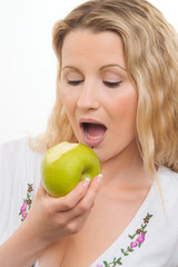 Young housewife with green apple