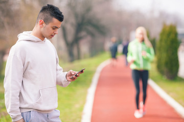 Focus on young coach measuring time 