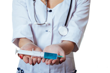 Woman in face mask and white lab coat. Doctor or nurse with