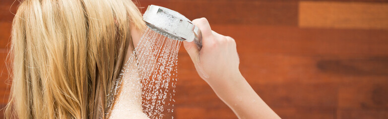 Blonde woman taking a shower