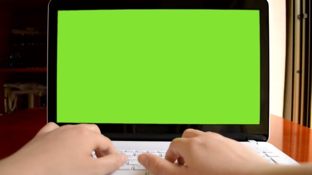 close up of business man writing on laptop