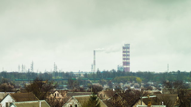 The plant, heavy industry, the smoke from pipes. Timelapse