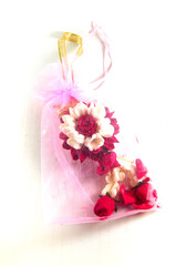 Obraz na płótnie Canvas Jasmine garland made from soap in pink bag