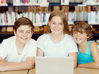 Three kids in library