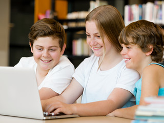 Three kids in library