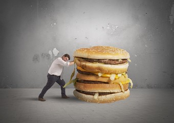 Man pushes a sandwich