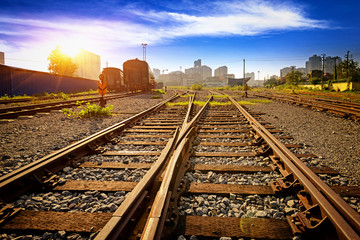 Cargo train platform at sunset with container