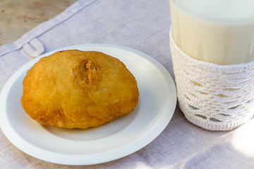 pirozhki, russian traditional food, with glass of milk, Meat pat