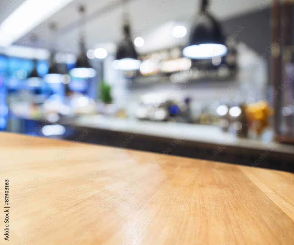 Wall mural table top with blurred kitchen background