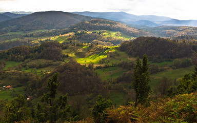 Mountain meadows at autumn illuminated by devine light