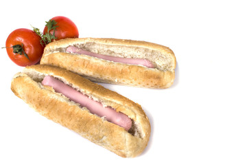 two fresh sausages on buns with hot dogs
