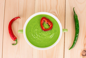 Broccoli cream soup on table.