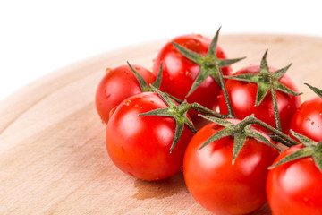 Bunch of tomatoes cherry on wood.