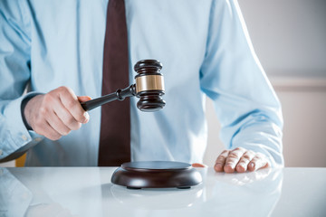 Lawyer or auctioneer raising his gavel