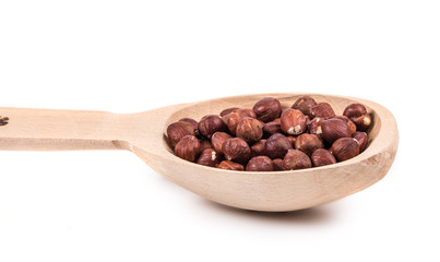 Wooden spoon with nuts.