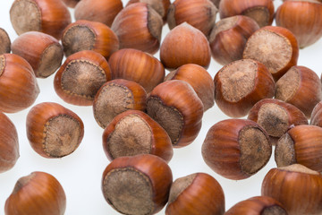 Pile of hazelnuts isolated on white background