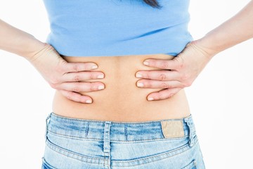 Fototapeta premium Pretty brunette suffering from back pain