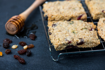 Homemade muesli and oat cookies with fruits and honey