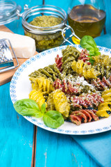 Homemade fresh pest with pasta with grated parmesan