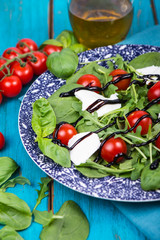 Healthy diet salad with tomatoes, mozzarella,basil and balsamic